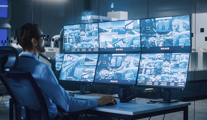 Person monitoring real-time video feed