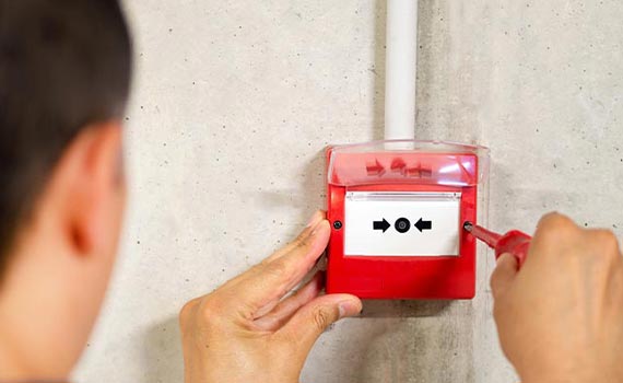 electrician installing fire alarm system